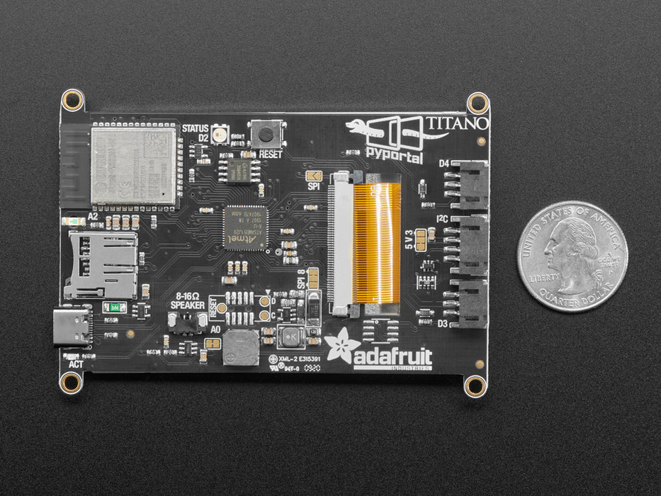 Hand holding PyPortal Titano development board with SAMD51, ESP32 Wifi, and 3.5" touchscreen TFT display.