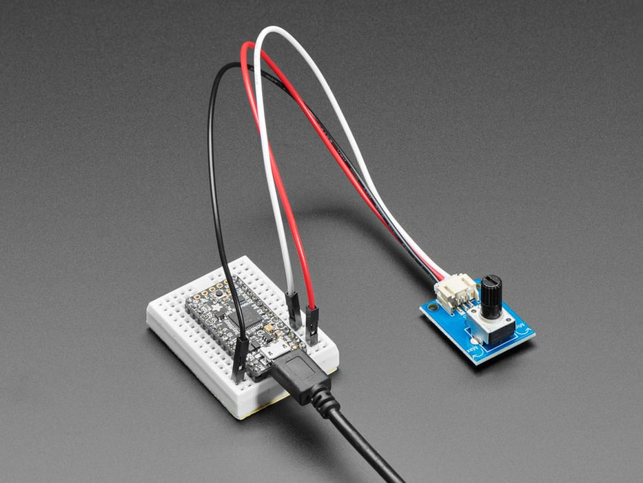 Video of a white hand turning the knob on a STEMMA Wired Potentiometer Breakout Board connect to a breadboard. Color changes when the knob is twisted. 