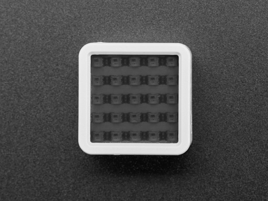 Angled shot of a M5Stack ATOM Matrix ESP32 Development Kit. 