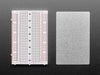 Angled shot of Half-Size Breadboard with Mounting Holes.