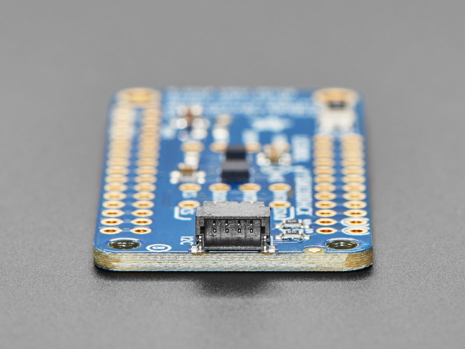 Top down view of a Adafruit ISM330DHCX + LIS3MDL FeatherWing.