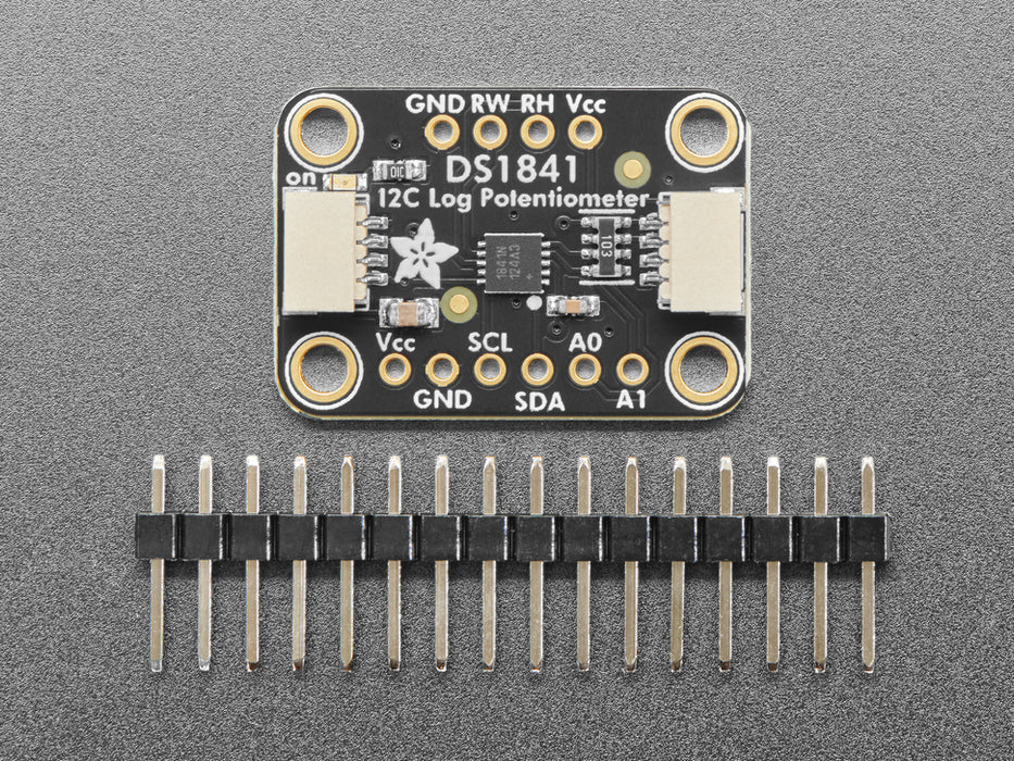 Angled shot of black, rectangular, digital potentiometer breakout board.