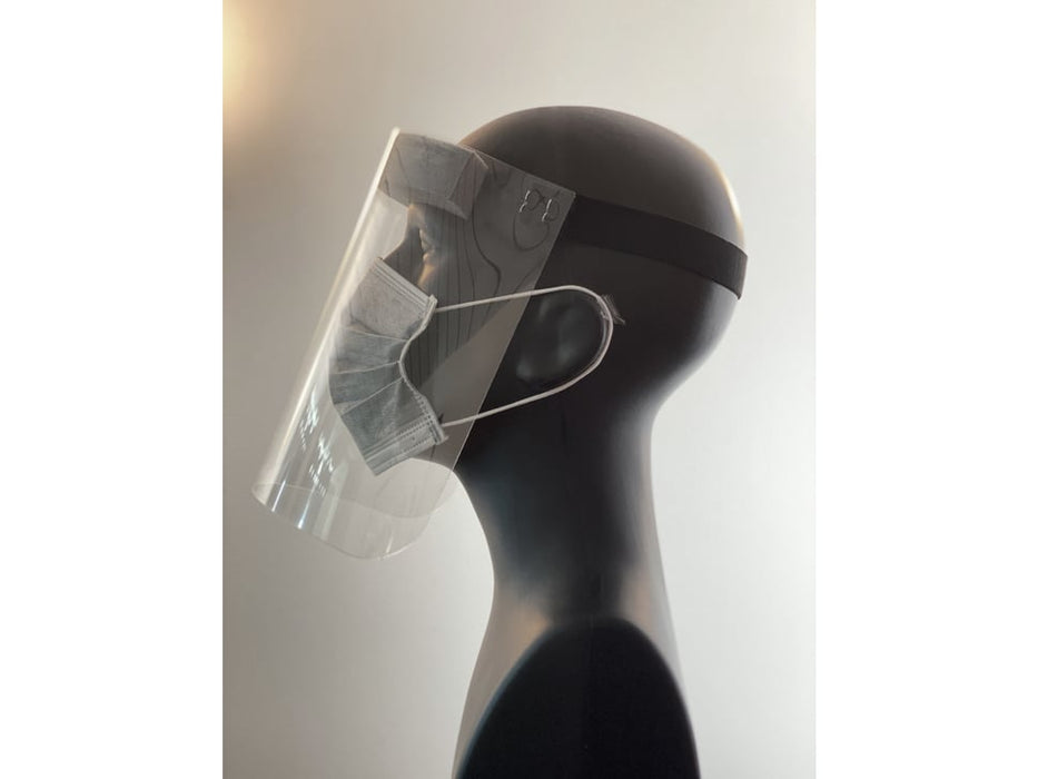 Side profile of the face shield on a mannequin head. Shield starts at the forehead and ends below the chin