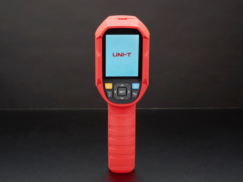 Thermal camera displaying a thermal image on it's lcd screen. Camera is red and grey, with the screen at the top of the camera and a handle at the bottom