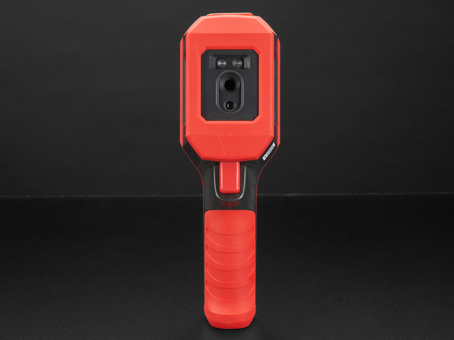 Thermal camera displaying a thermal image on it's lcd screen. Camera is red and grey, with the screen at the top of the camera and a handle at the bottom.