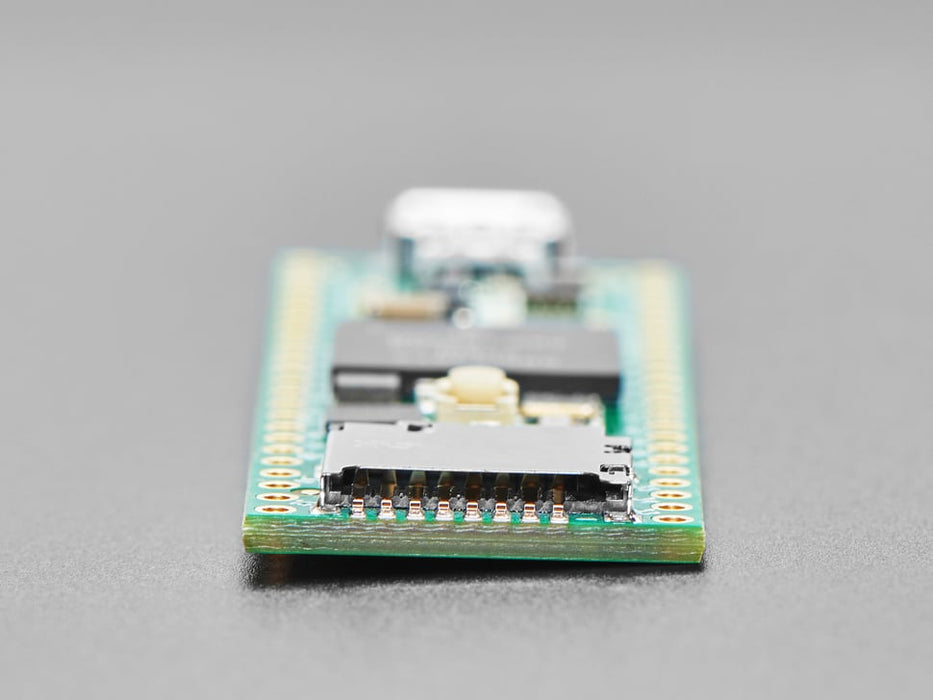 Angled shot of long green rectangular microcontroller.