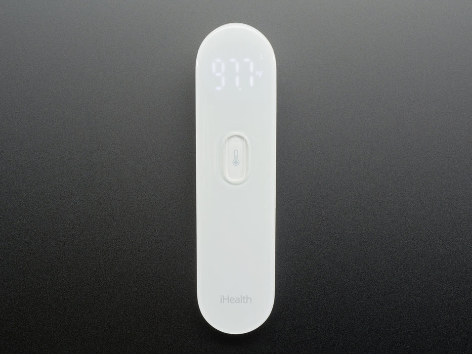 White no touch thermometer shown laying flat and displaying a temperature