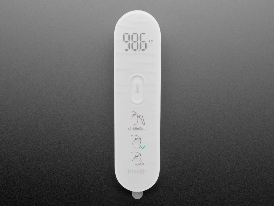 White no touch thermometer shown laying flat and displaying a temperature