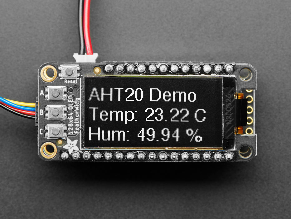 Video of a Adafruit FeatherWing OLED - 128x64 OLED Add-on For Feather - STEMMA QT / Qwiic connected to a temp and humidity sensor. Display reads "Adafruit" and various Temp and Humidity measures.  