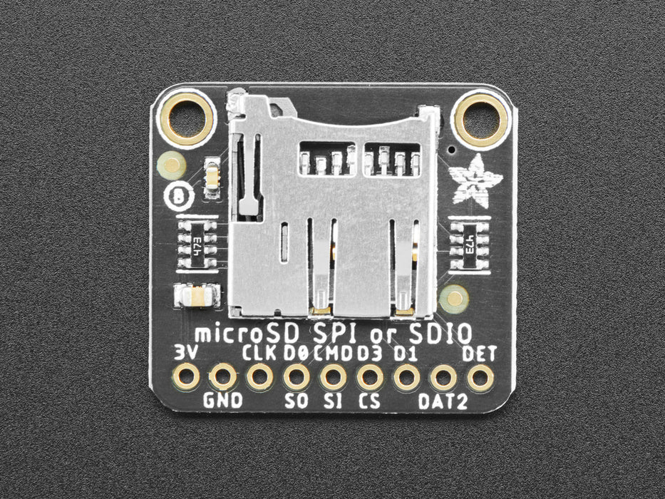 Angled shot of a Adafruit Micro SD SPI or SDIO Card Breakout Board. 