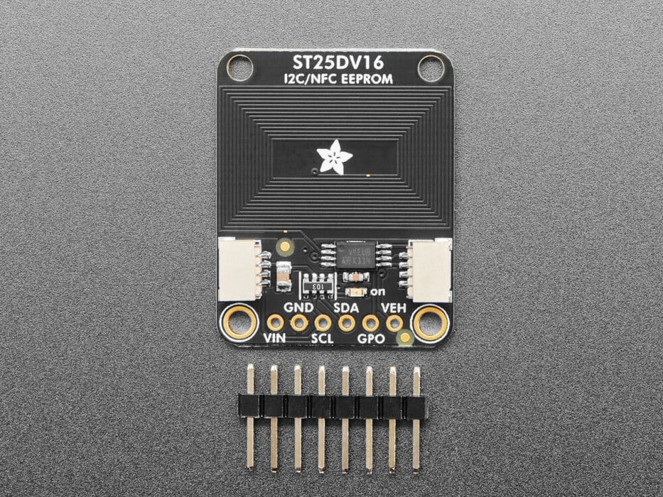 Hand brings phone close to breakout board, and shows phone recognizing an RFID tag