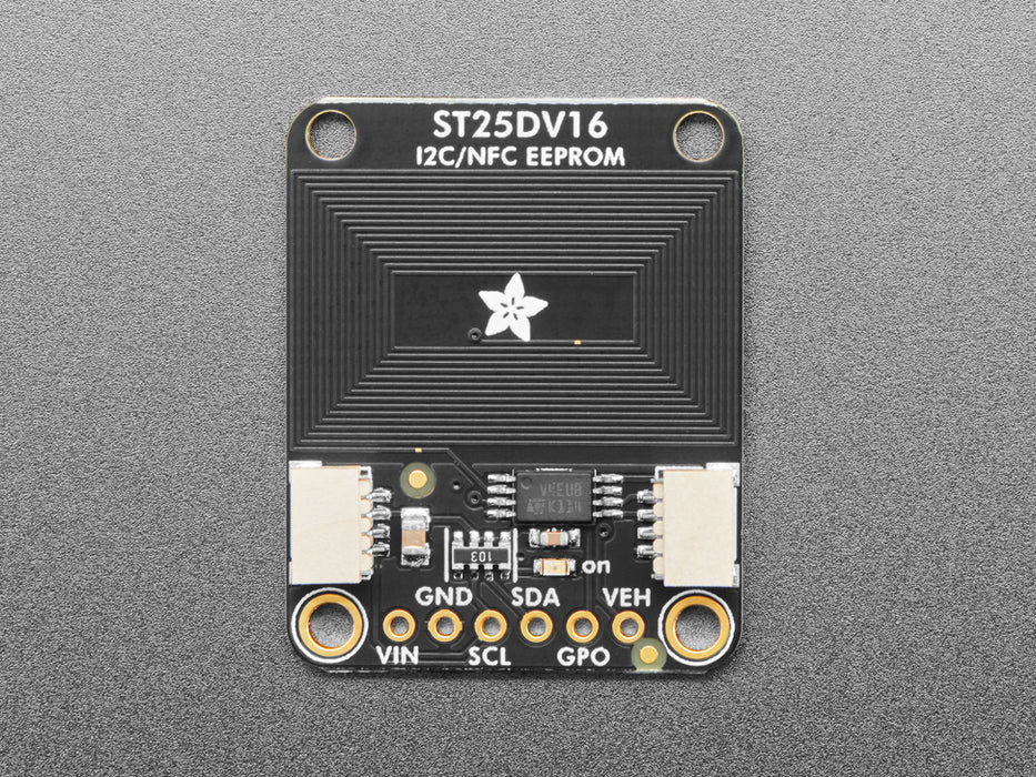 Hand brings phone close to breakout board, and shows phone recognizing an RFID tag