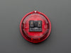 Angled shot of a translucent red round 30mm arcade button. 