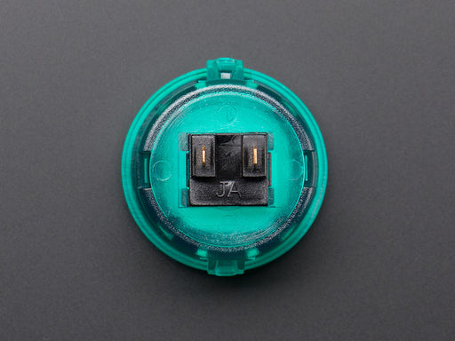 Angled shot of a translucent green round 30mm arcade button. 