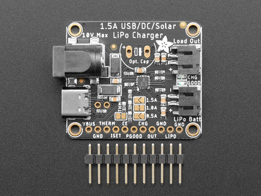 Angled shot of a Adafruit Universal USB / DC / Solar Lithium Ion/Polymer charger connected to a solar panel and 3 AAA batteries. 