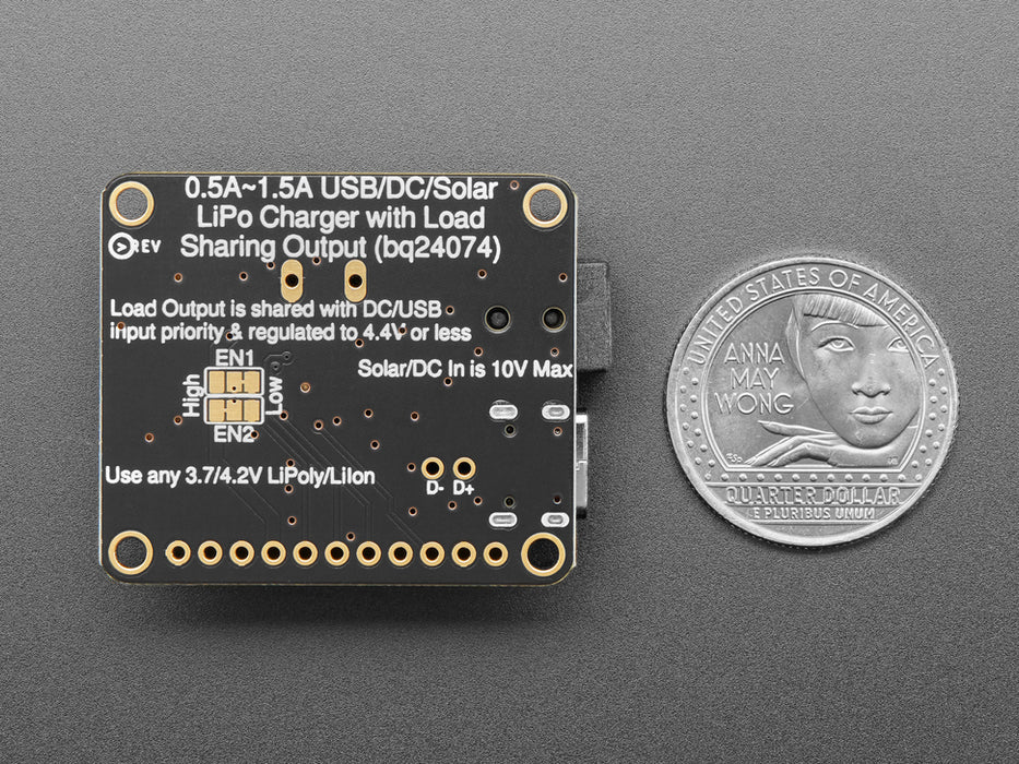 Angled shot of a Adafruit Universal USB / DC / Solar Lithium Ion/Polymer charger connected to a solar panel and 3 AAA batteries. 