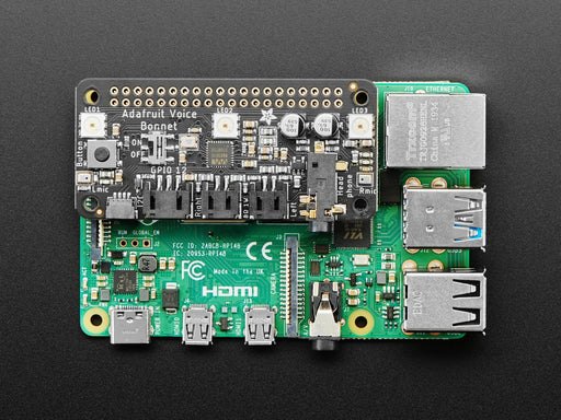 Top down view of a Adafruit Voice Bonnet for Raspberry Pi connected to a Pi/