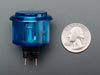 Angled shot of a translucent blue round 30mm arcade button. 