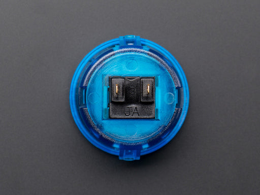 Angled shot of a translucent blue round 30mm arcade button. 