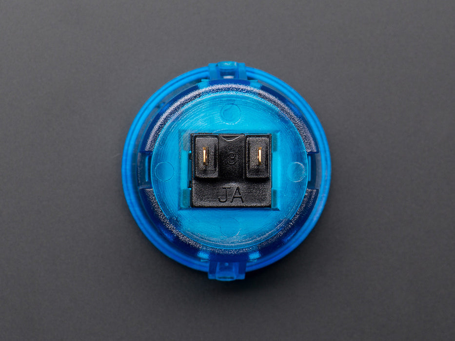 Angled shot of a translucent blue round 30mm arcade button. 