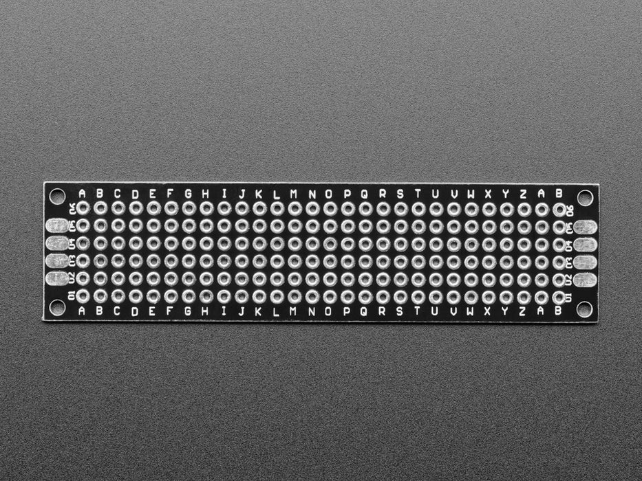 Angled shot of single Universal Proto-board PCB 2cm x 8cm