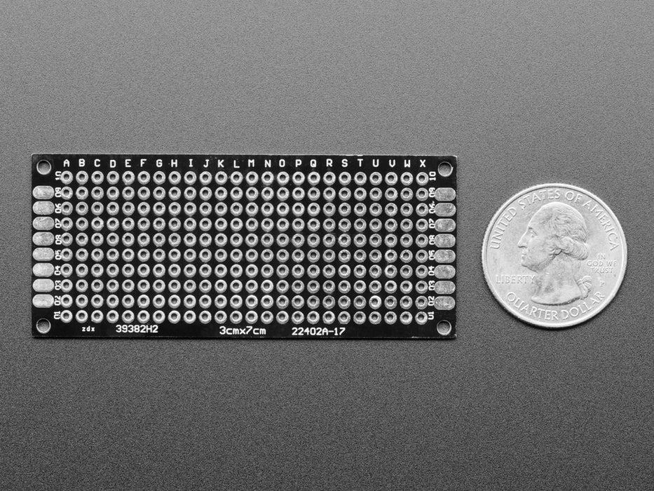 Angled shot of single Universal Proto-board PCB 3cm x 7cm.