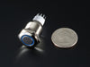 Angled shot of rugged metal pushbutton with blue led ring.