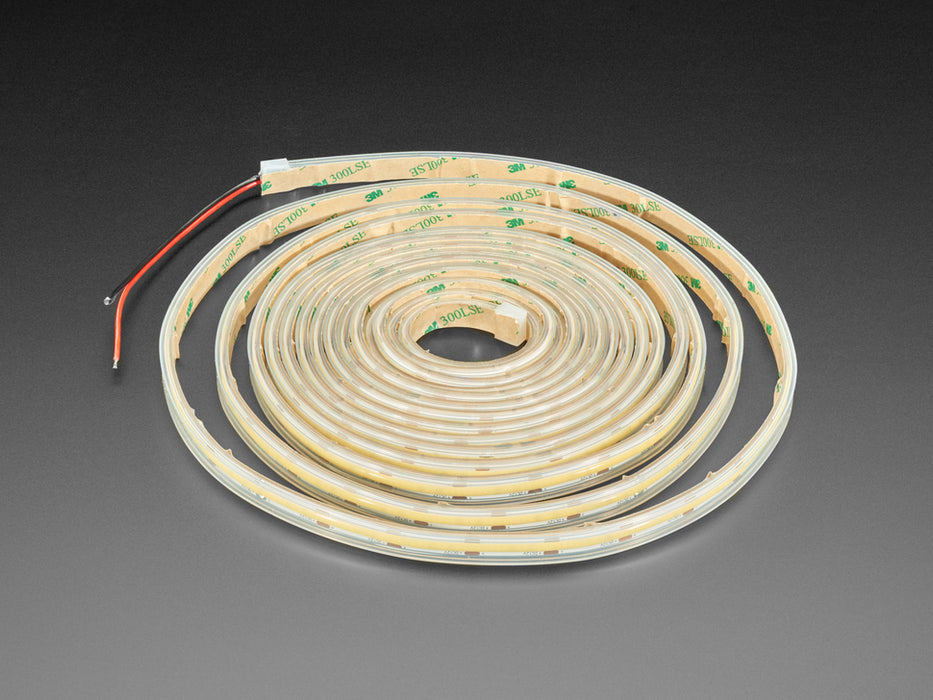 Long coiled LED strip lit up cool white