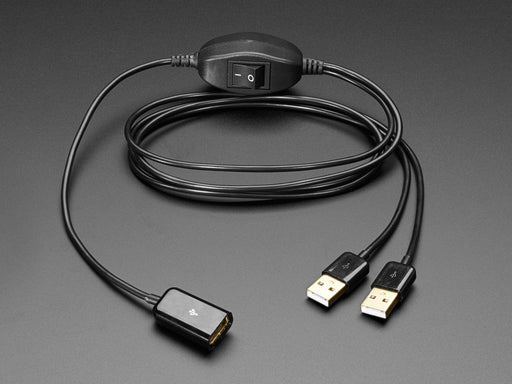 Angled shot of USB cable with on-off switch connected to a laptop port, a Raspberry Pi computer, and a USB key.