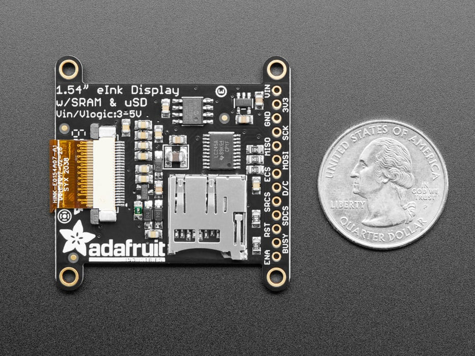 Video of a 1.54" tri-color eInk display assembled on a breadboard with jumper wires and a QT Py. Friendly snake in white-and-red, Blinka, appears on the display.