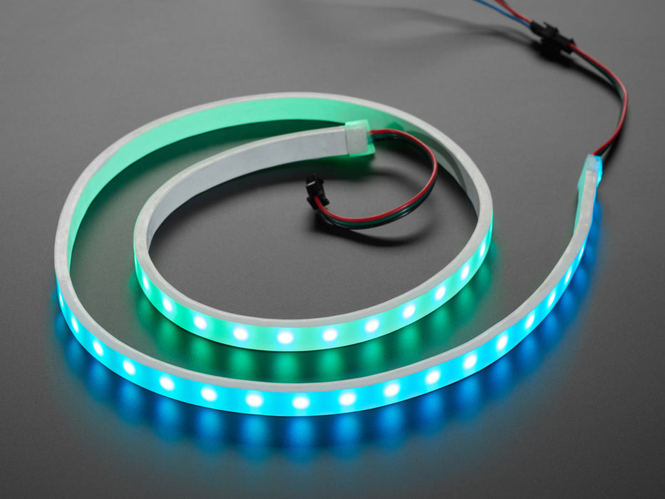 Video of loosely coiled LED strip flashing rainbow colors.