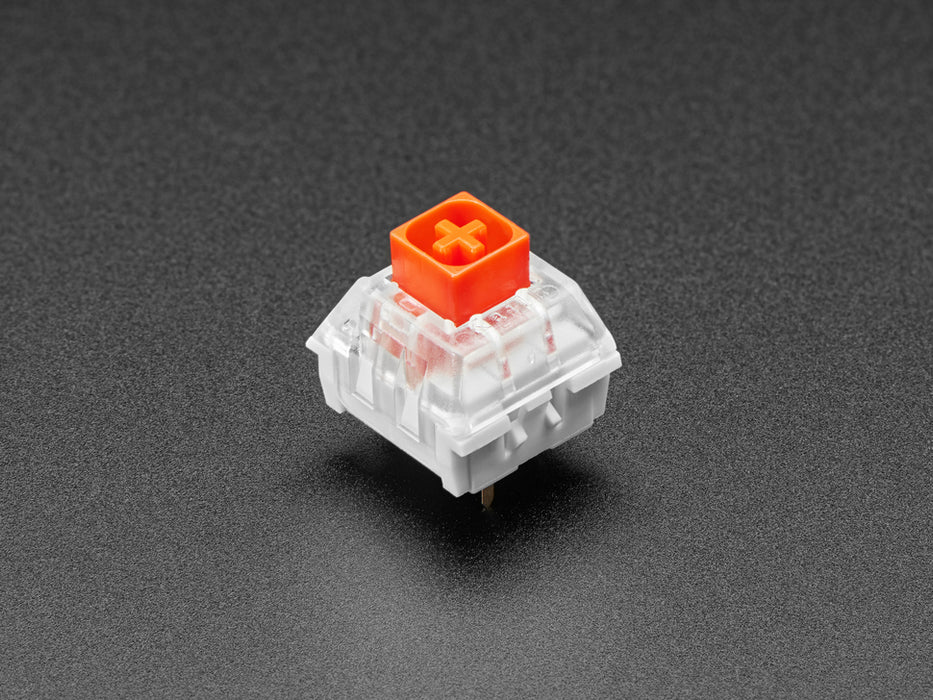 Angled shot of ten red Kailh key switches.