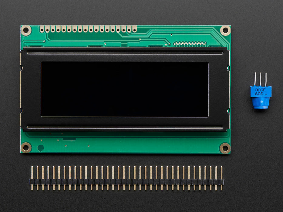 LCD wired on breadboard with backlight changing color with text displayed: "This 20x4 Character LCD comes with an RGB backlight so you can change how it looks".