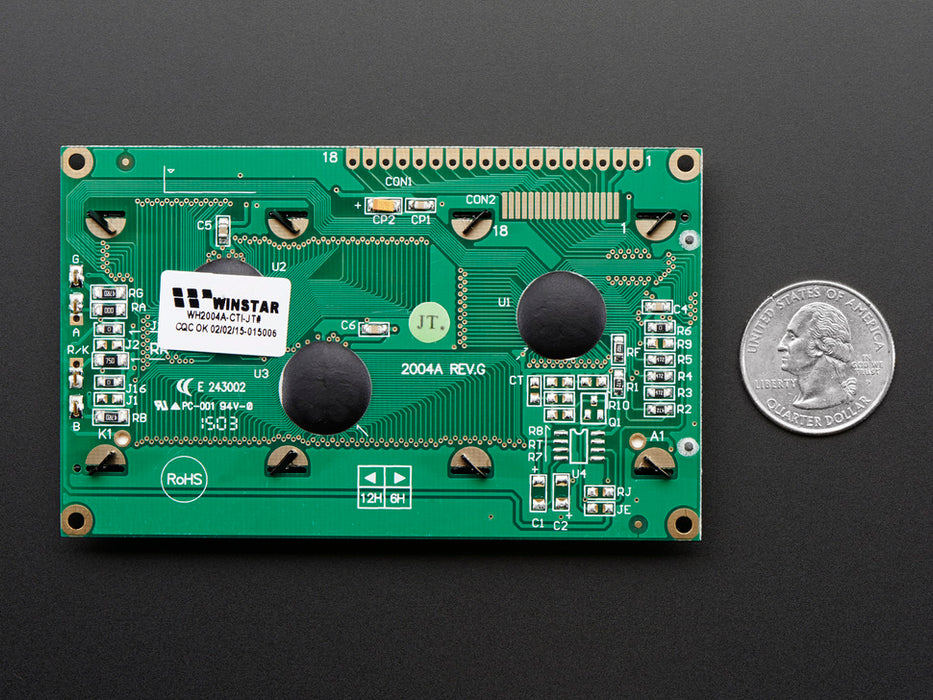 LCD wired on breadboard with backlight changing color with text displayed: "This 20x4 Character LCD comes with an RGB backlight so you can change how it looks".