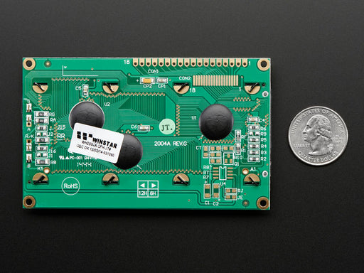 LCD wired on breadboard with backlight changing color with text displayed: "This 20x4 Character LCD comes with an RGB backlight so you can change how it looks".