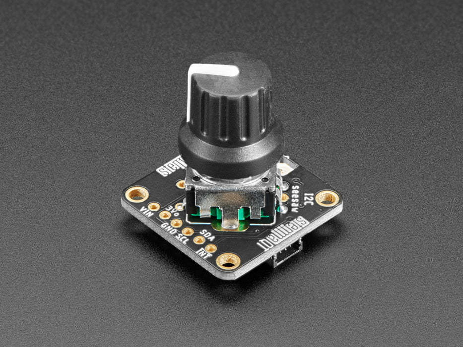 Top view video of a gloved hand turning the rotary encoder knobs on three PCBs. The NeoPixel LEDs on each PCB change color. The OLED display changes its readout data with each twisty-turn.