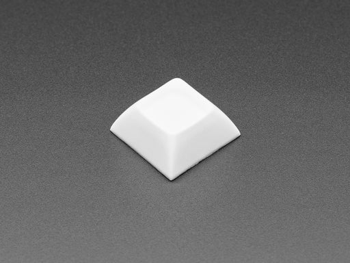 Angled shot of 10 white plastic keycaps.