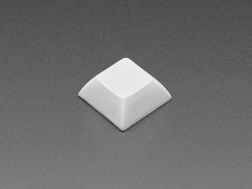 Angled shot of 10 gray plastic keycaps.