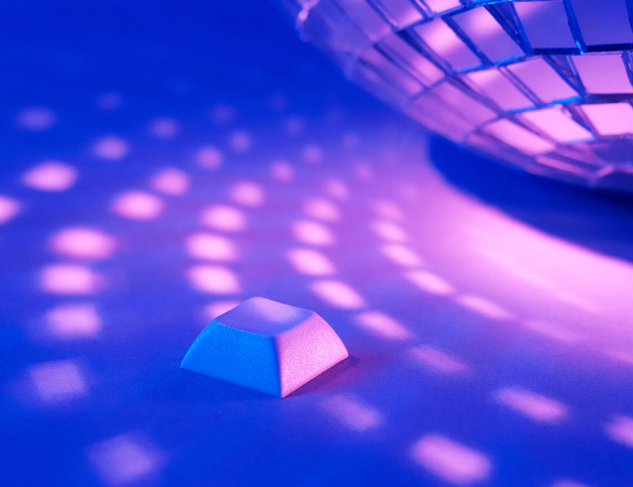 Angled shot of 10 gray plastic keycaps.