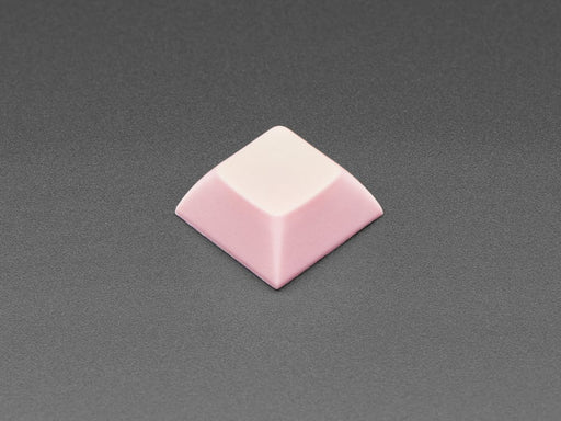 Angled shot of 10 pink plastic keycaps.