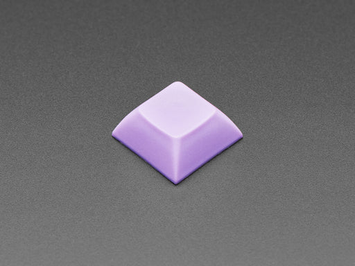 Angled shot of 10 lavender plastic keycaps.