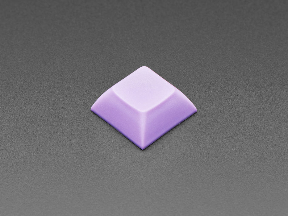 Angled shot of 10 lavender plastic keycaps.