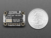 Top view of temperature sensor breakout above an OLED display FeatherWing. The OLED display reads "MCP9808 Temp: 24.19��C"