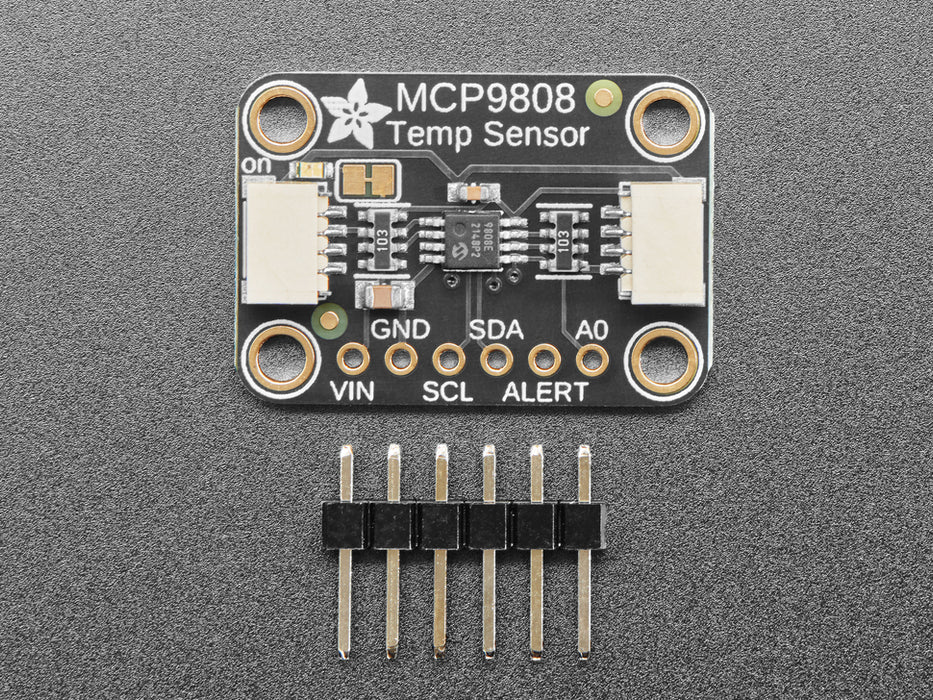 Top view of temperature sensor breakout above an OLED display FeatherWing. The OLED display reads "MCP9808 Temp: 24.19��C"