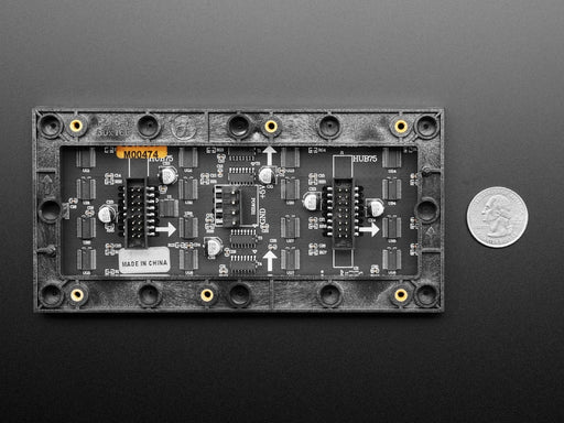 Front on view of an RGB Matrix panel displaying "Adafruit" along with geometric shapes.