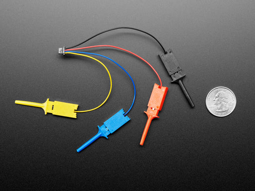 Angled shot of a QT Py microcontroller plugged into a JST-SH cable with four micro SMT test hooks in yellow, blue, red, and black. The test hooks grip the first four connections on a breakout board.