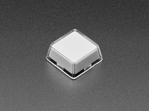 Angled shot of ten white plastic keycaps.