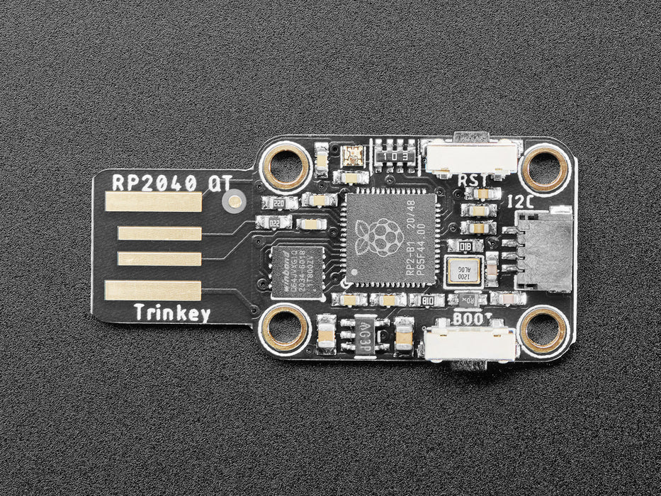 Video of Trinkey RP2040 plugged into a laptop. An OLED display is connected and shows a graphic keyboard cat animation.