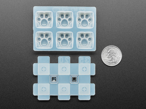 Top view of two-piece rubber kitty paw keycap molds