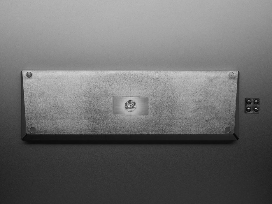 Angled shot of a Translucent Smoke Plastic 65% / JKDK K68 Keyboard Shell. 